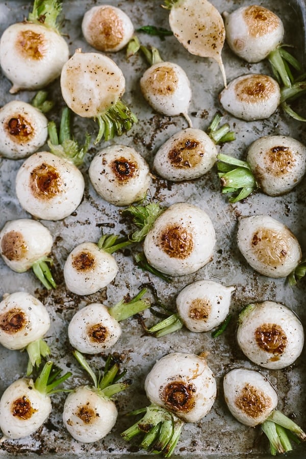 Roasted hakurei turnips on sheet pan right after they are cooked.