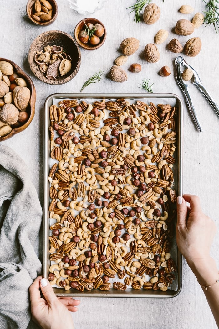 Spicy Candied Nuts arranged on a sheet pan