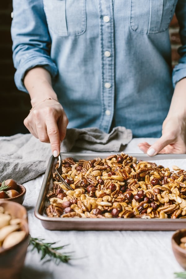 Person playing nuts on a sheet pan