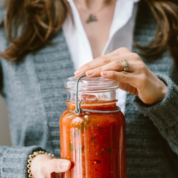 A foolproof recipe for homemade tomato basil sauce recipe with tips and tricks on storing and freezing.