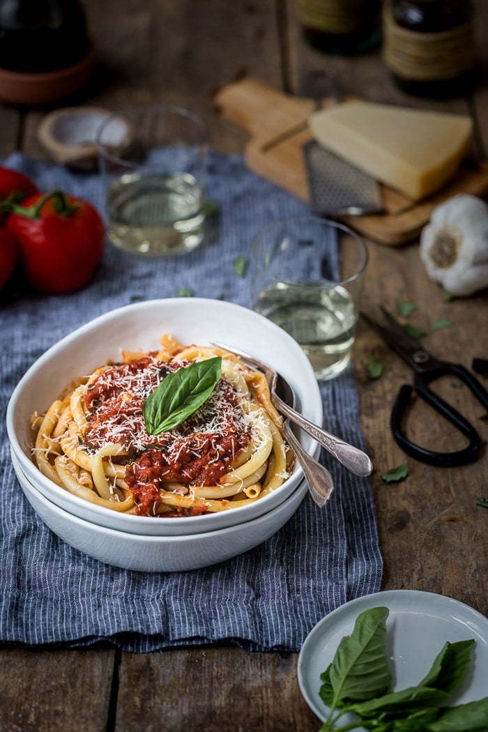 a bowl of pasta topped off with Tomato Basil Pasta Sauce