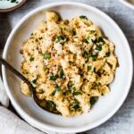 A bowl of Vegan Mac and Cheese with cashew cheese sauce is in a bowl