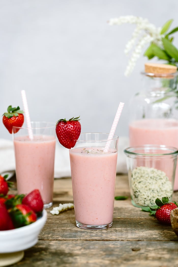 A few glasses of Strawberry Banana Yogurt Smoothie are photographed from the front view.