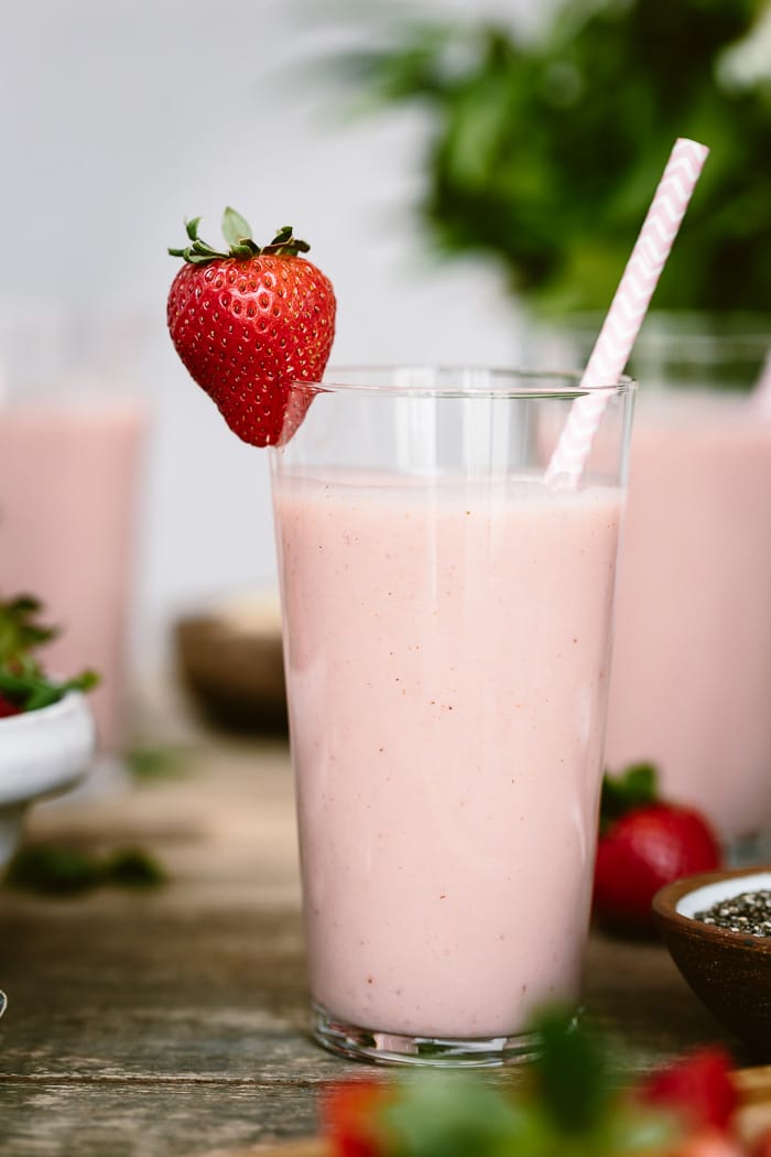 A glass of Strawberry Banana Yogurt Smoothie is photographed close up from the front view.