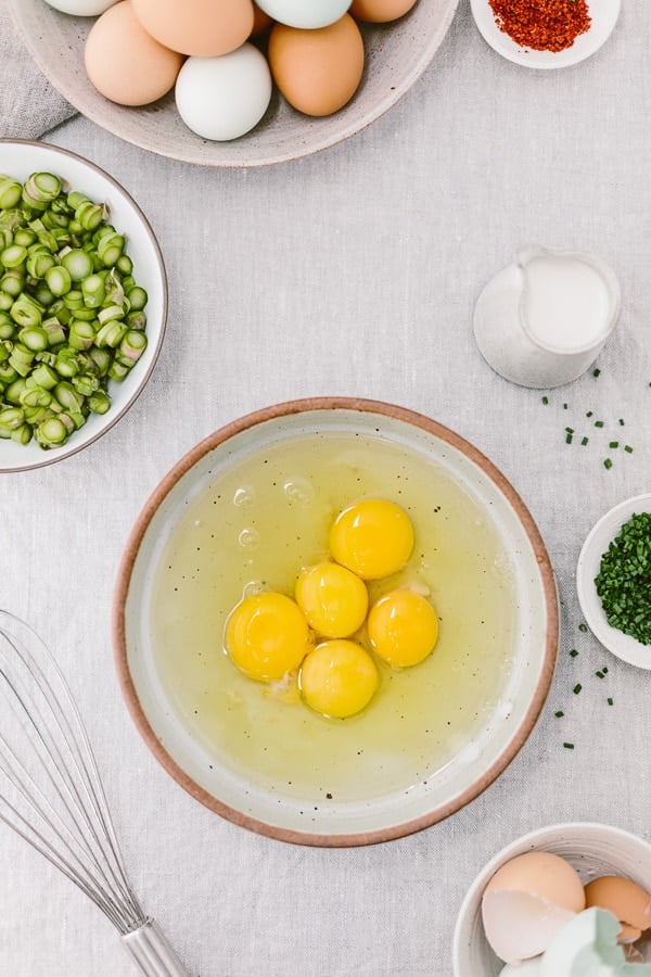 Truffled Asparagus Eggs on Toast Recipe: A quick and easy open-face sandwich recipe made with asparagus sautéed with truffle oil and mixed with eggs and goat cheese.