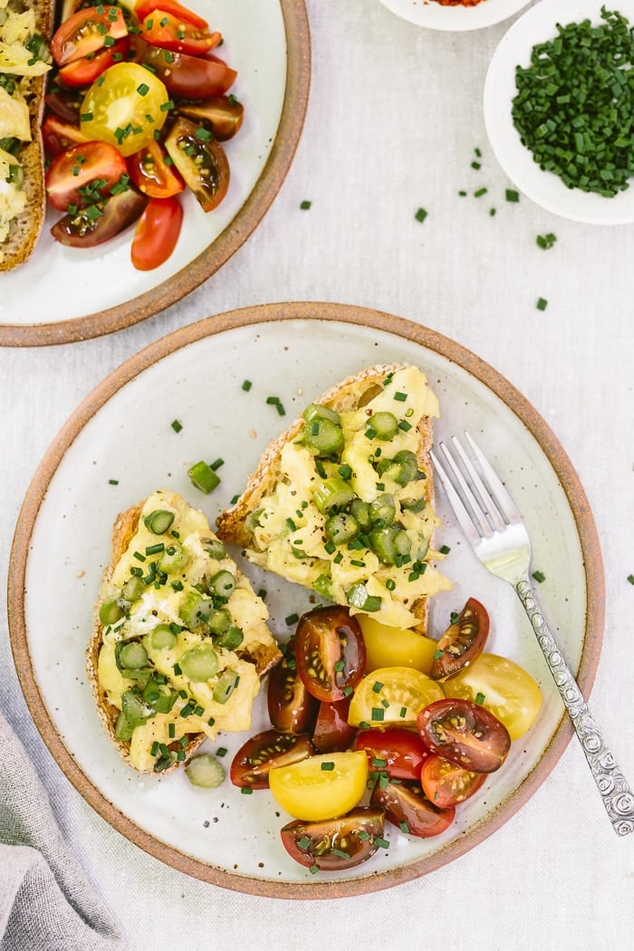 Truffled Asparagus Eggs on Toast Recipe: A quick and easy open-face sandwich recipe made with asparagus sautéed with truffle oil and mixed with eggs and goat cheese.