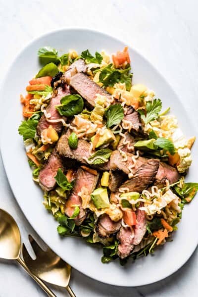 Thai Steak and noodle salad in an oval plate from the top view