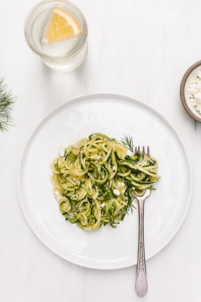 5 Ingredient Zucchini Noodles Recipe - A vegetarian spiralized zucchini noodle pasta recipe made with olive oil, garlic, dill and feta.
