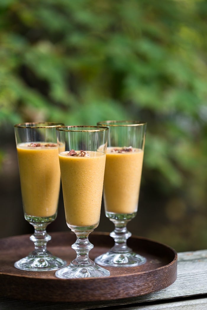 three glasses of vegan pumpkin smoothie on a tray