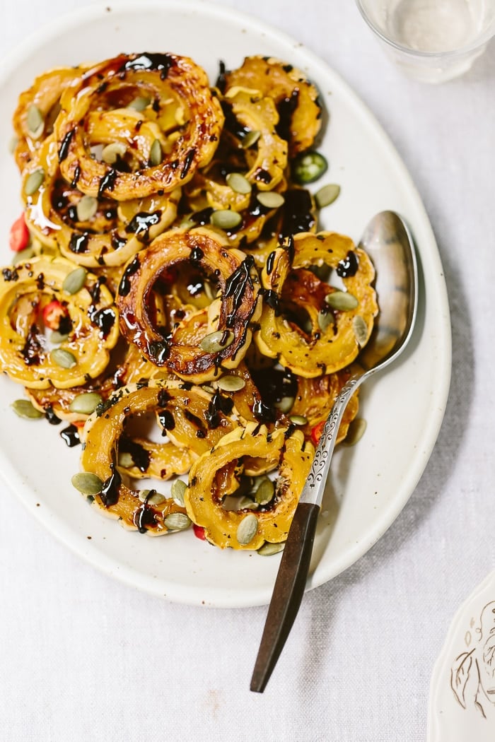 roasted delicata squash rings topped off with pumpkin seeds