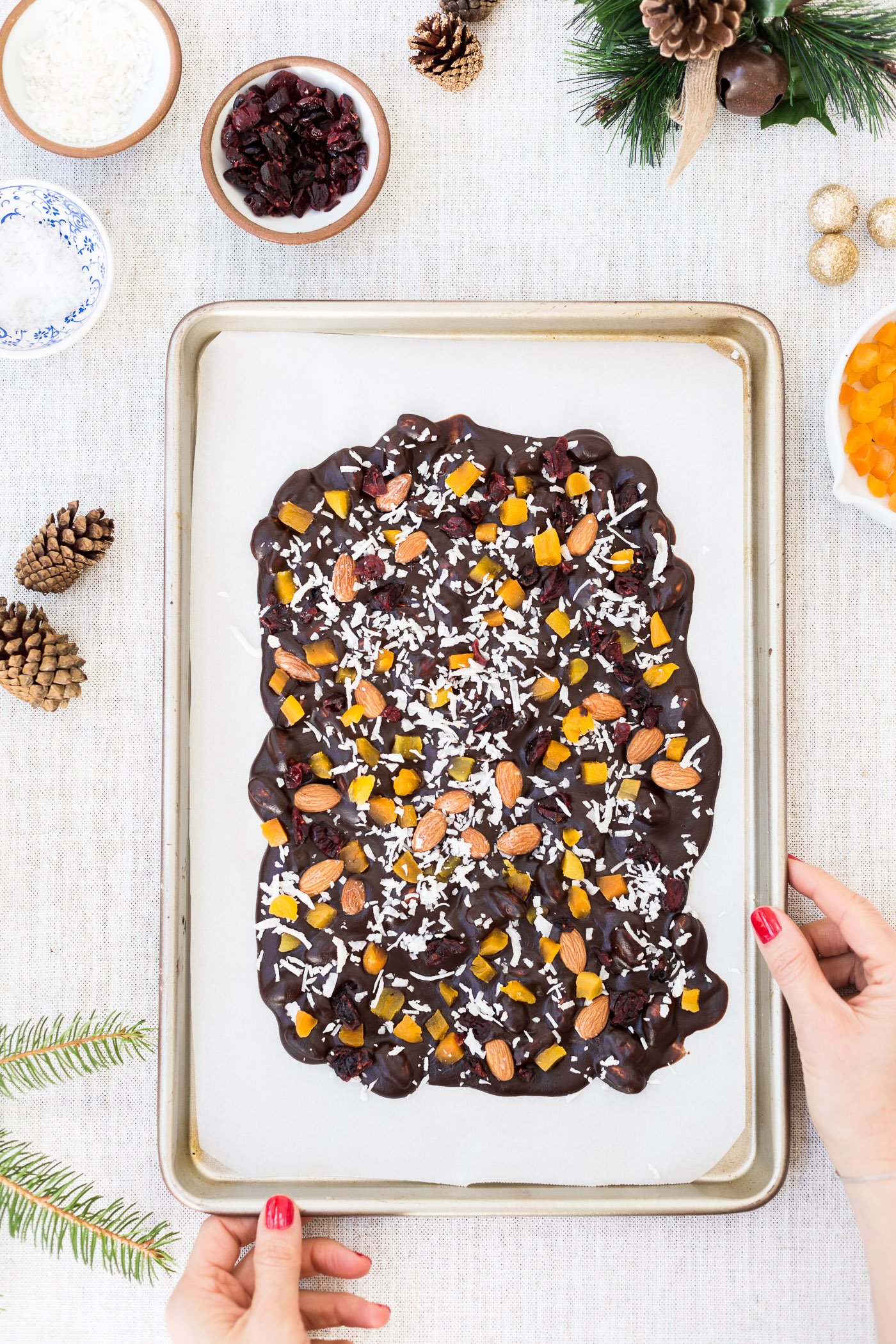 Coconut oil based and maple-sweetened Easy Bark recipe top view held by a woman