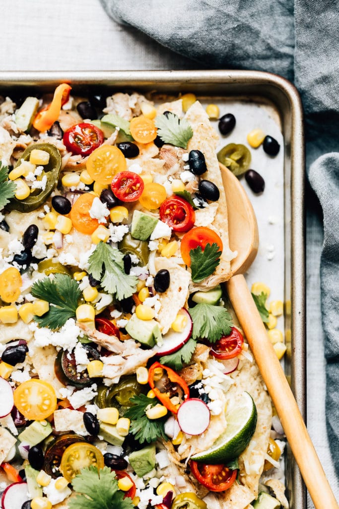 Sheet-Pan Chicken Nachos Photographed from the top view from a closer view.