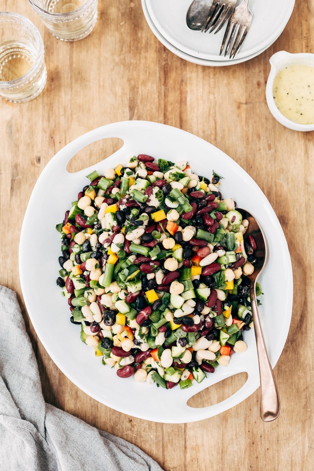 A plate of recipe for five bean salad is photographed from the top view.