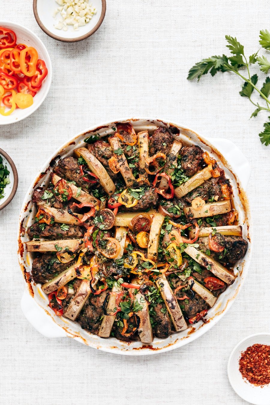 A freshly baked Turkish meatball potato bake is photographed right after it came out of the oven from the top view.