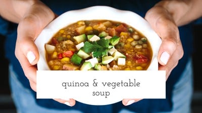 Quinoa and Vegetable Stew in a bowl served by a person
