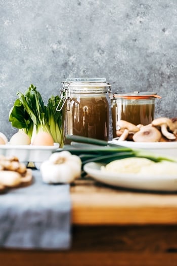 The ingredients for Weeknight Vegetarian Ramen Broth and Bowl with Shiitake Mushrooms and Bok Choy photographed from the front view.