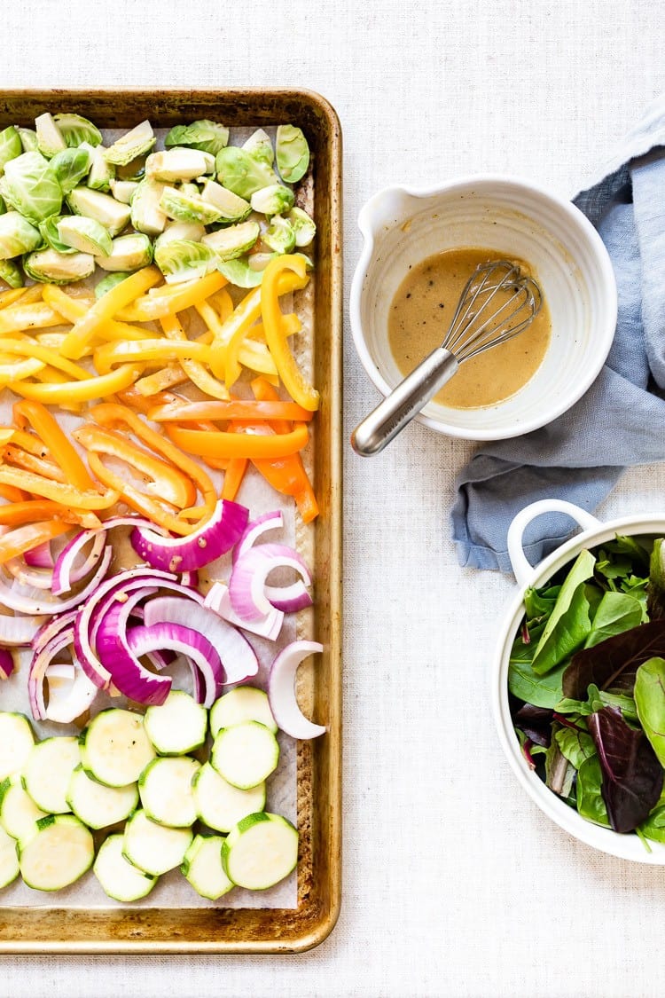 Lemon Vinaigrette Dressing with sliced veggies and greens on the side