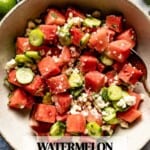Watermelon salad in a bowl with text on the image.