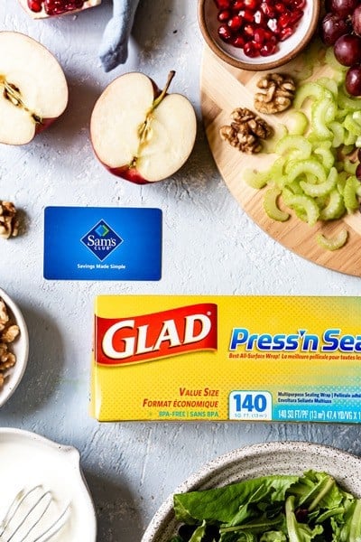 Waldorf Salad Dressing Recipe with apples, a shopping card, and stretch film box