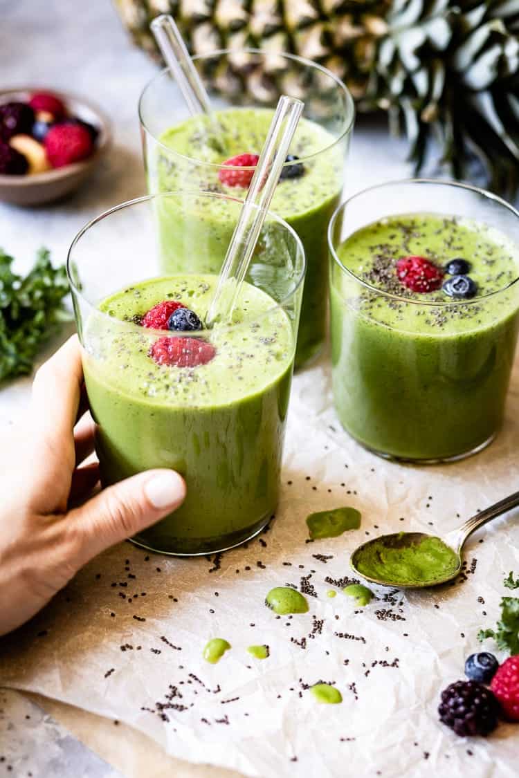 A few cups of kale Pineapple Smoothie is being served