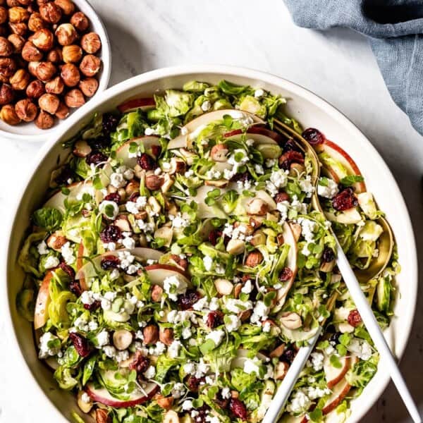 Shaved Brussel Sprout Salad with Apples and Goat Cheese - Learn how to make the most flavorful Raw Brussel Sprout Salad recipe