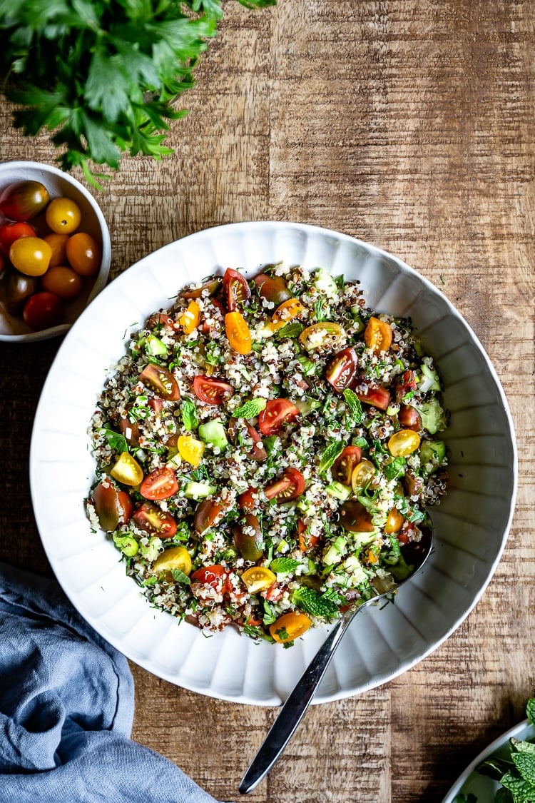 Quinoa Tabbouleh Salad served in a big bowl with a spoon on the side