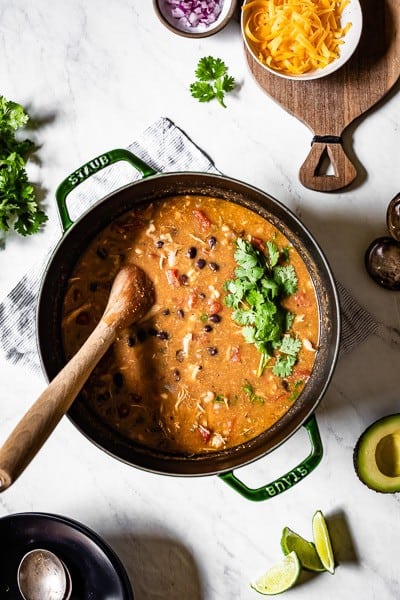 Shredded chicken chili served in a large pot