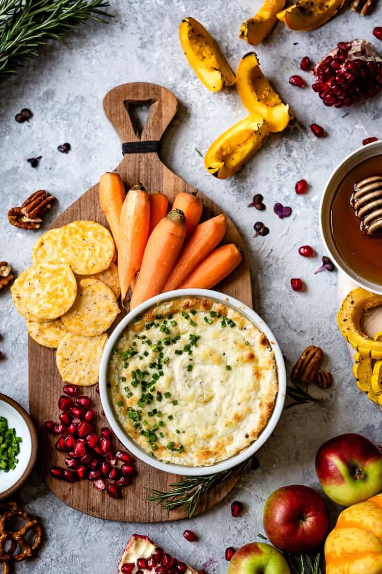 Baked Goat Cheese Dip recipe served with vegetables and crackers