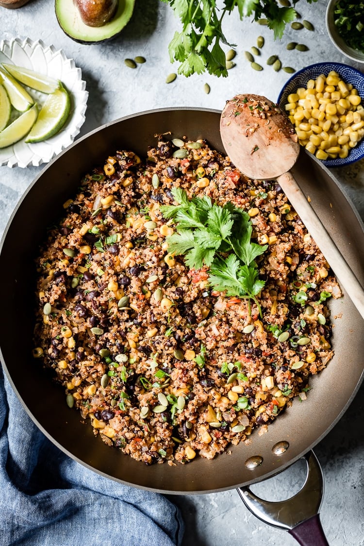 Easy Quinoa Recipes - Quinoa with black beans is photographed in a pan from the top view