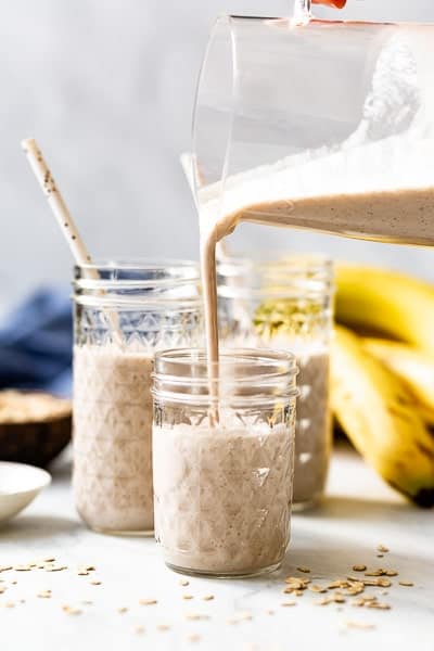 Simple Banana Smoothie being poured into a glass