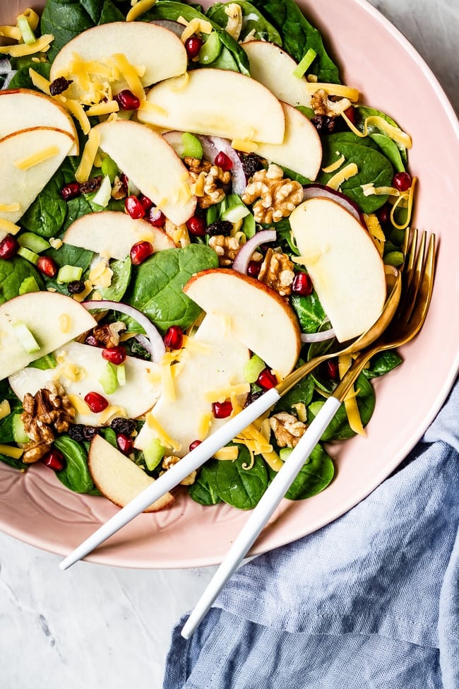 a bowl of apple salad recipes with fresh apples close up