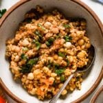 Bulgur pilaf in a bowl with a spoon in the dish
