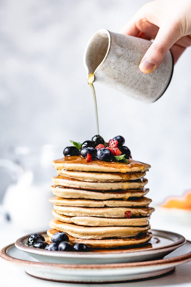 Almond Flour Pancakes Recipe being drizzled with maple syrup