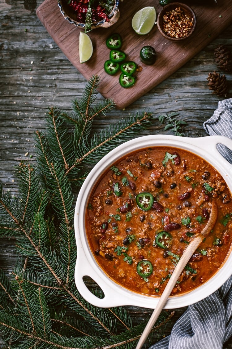 This 3 Bean Chili is one of my favorite easy to make Mexican food. Served in a white bowl with a wooden spoon in the bowl