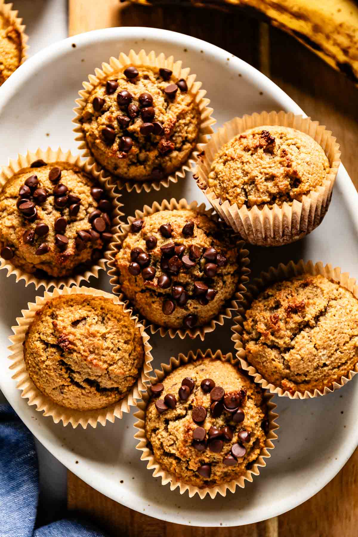 Gluten free banana muffins with almond flour and chocolate chips on a plate from the top view.