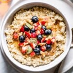 pressure cooker steel cut oats in a bowl garnished with fruit