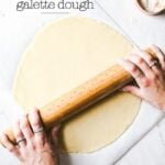 Learn how to make homemade galette dough from scratch - a woman is rolling out a dough