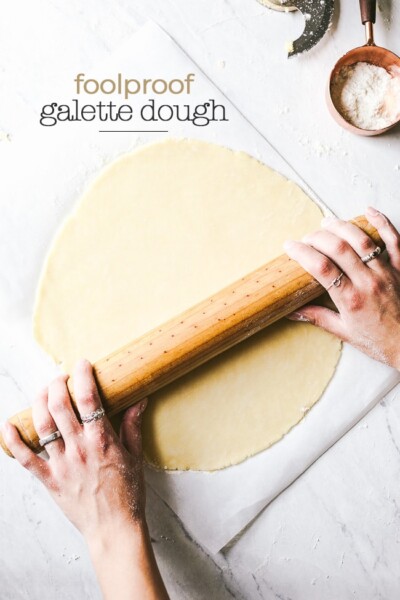 Learn how to make homemade galette dough from scratch - a woman is rolling out a dough