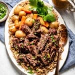 Pressure Cooker Pot Roast with Potatoes and Carrots served over a bed of bulgur pilaf