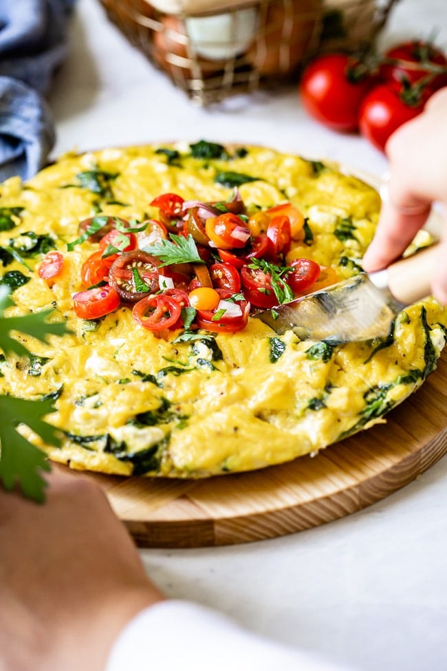 Spinach Egg Frittata recipe photographed as it is being sliced