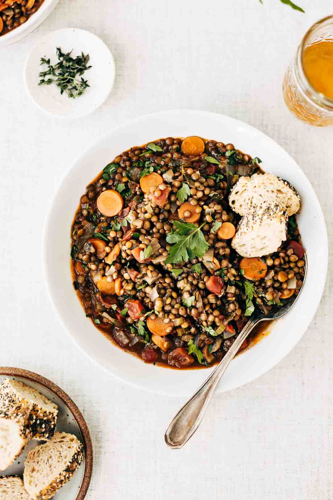 A bowl of French Lentil soup with bread on the side