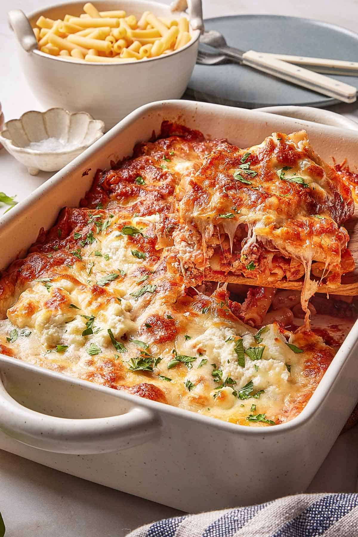 Baked ziti with meat sauce in a casserole dish.