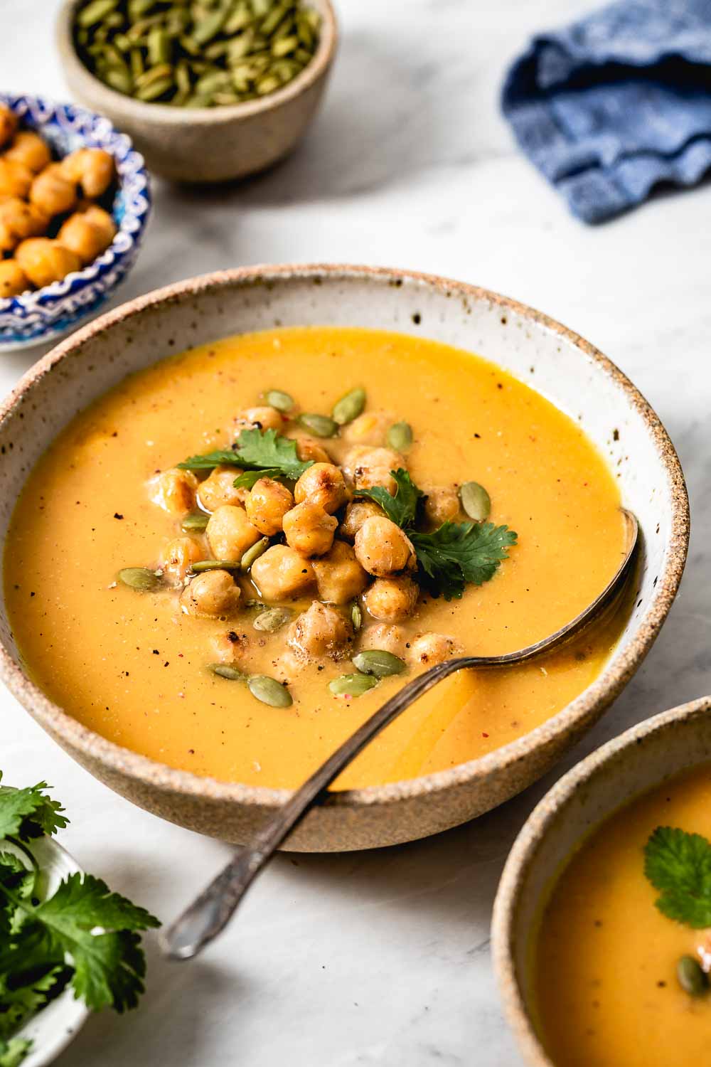 Vegan Creamy Sweet potato vegetable soup is photographed from the front view from a closeup view.