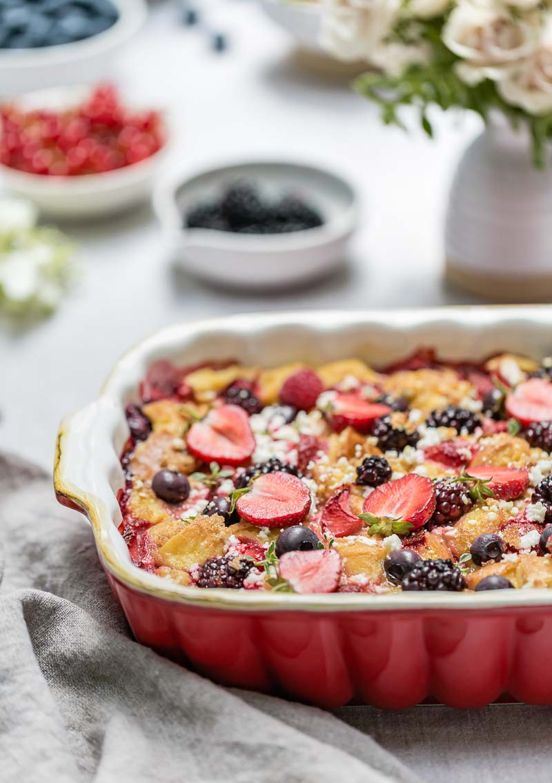 Goat cheese berry pudding in a casserole dish from the front view