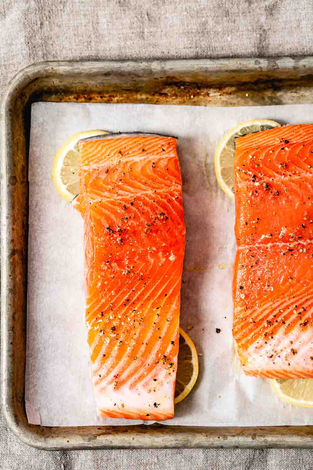 Learn how to cook salmon in the oven for a delicious salad recipe - fish photographed from the top view before it goes into the oven.