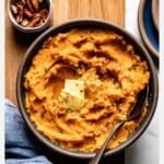 Creamy sweet potato mashed potatoes in a bowl with text on the image.