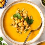 Vegan sweet potato soup in a bowl garnished with spices