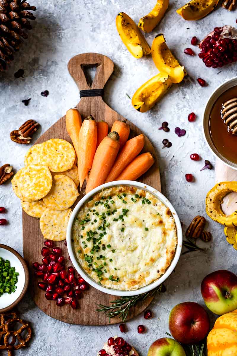 Baked goat cheese dip served with veggies, fruits and crackers.