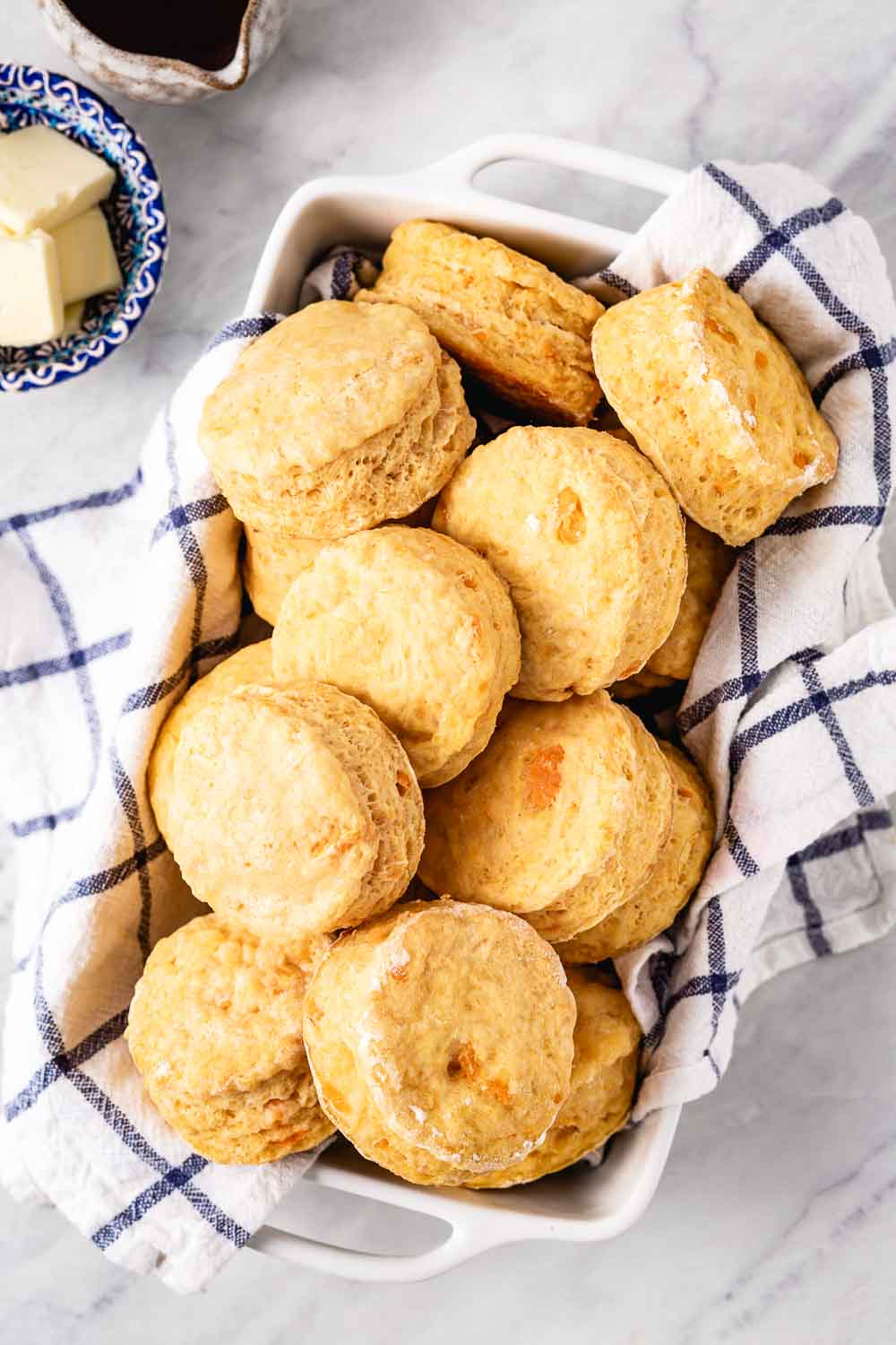 Old fashioned sweet potato biscuits are place in a casserole dish and photographed from the top view.