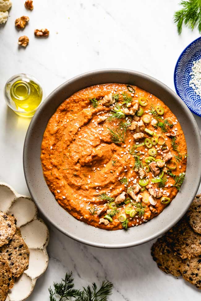 A bowl of muhammara recipe is photographed from the top view